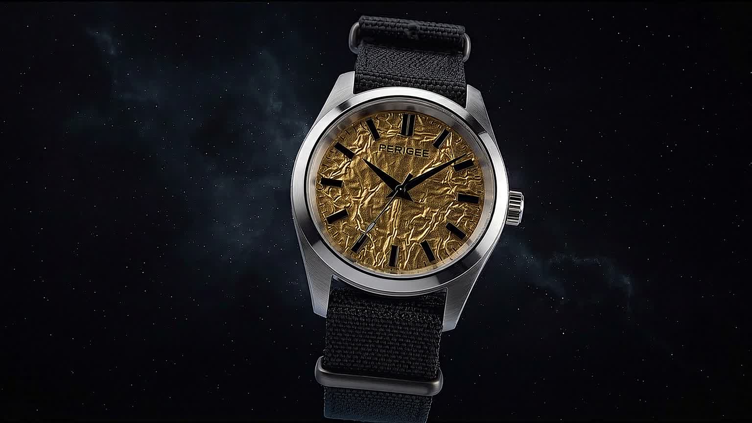 The finished PERIGEE watch: a Grade 2 titanium field case with a hand-crinkled gold foil dial, settled against a starfield.